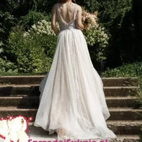 Designerska suknia ślubna z odkrytymi plecami od Luce Sposa